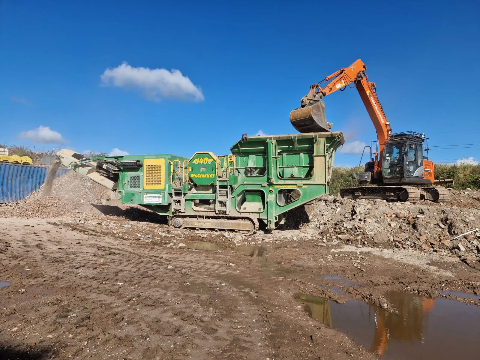 a construction site with a bulldozer and excavator